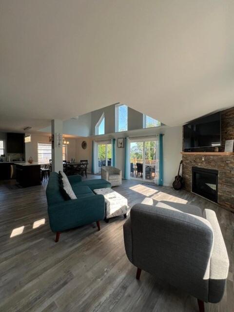 a living room with two couches and a fireplace at Chalet Montelago in The Hideout in Lake Ariel