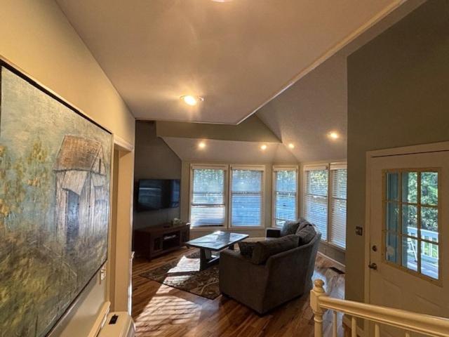 a living room with a couch and a table at Quiet and secluded home close to TIEC in Columbus