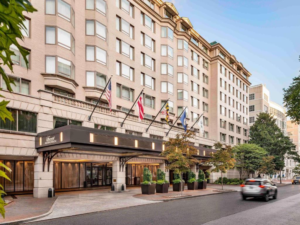 a building with flags on top of it at The Fairmont Washington DC in Washington