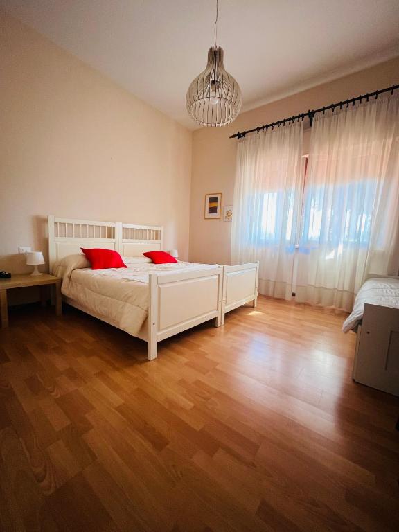 a bedroom with a bed with two red pillows at Da Benedetta in Cantagrillo