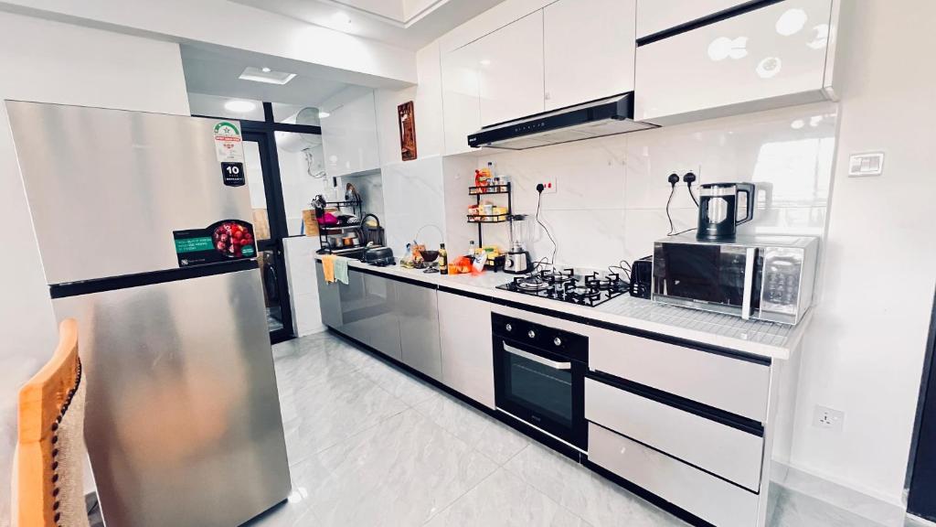 Kuchyň nebo kuchyňský kout v ubytování Orchid residency