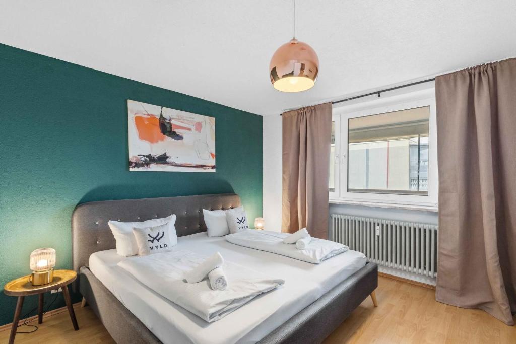 Postel nebo postele na pokoji v ubytování Modernes City Apartment mit Aussicht und WLAN