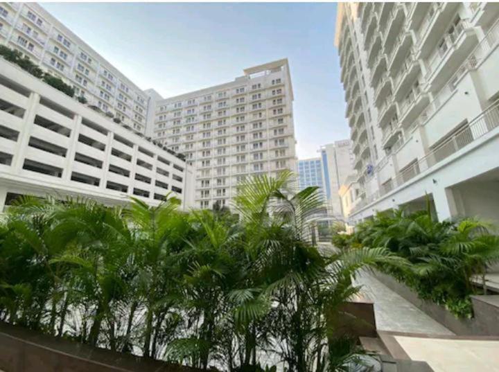 a view of a city with palm trees and buildings at Aryan Home Stay Lucknow in Lucknow
