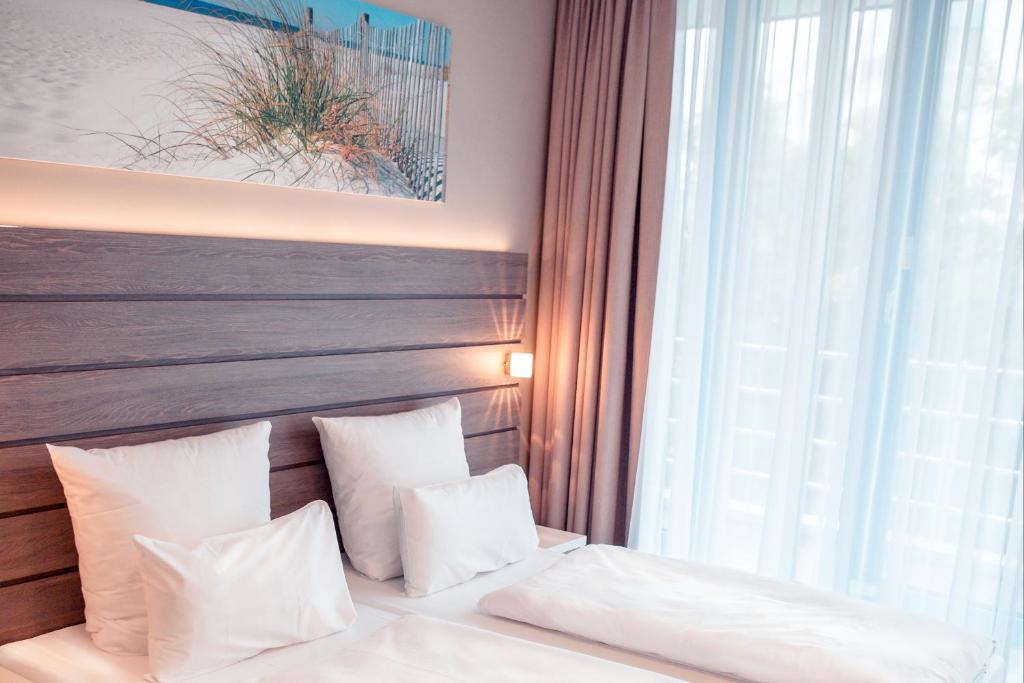Ein Bett oder Betten in einem Zimmer der Unterkunft Tulip Inn München Messe