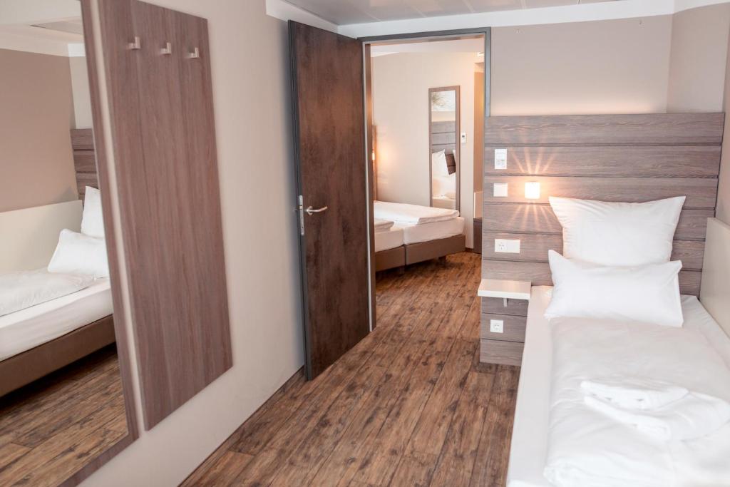 Ein Bett oder Betten in einem Zimmer der Unterkunft Tulip Inn München Messe