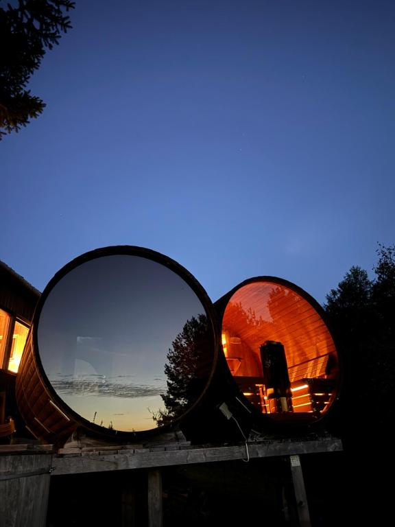 a mirror sitting on top of a wooden table at Sidorówka nad Wigrami in Krasnopol