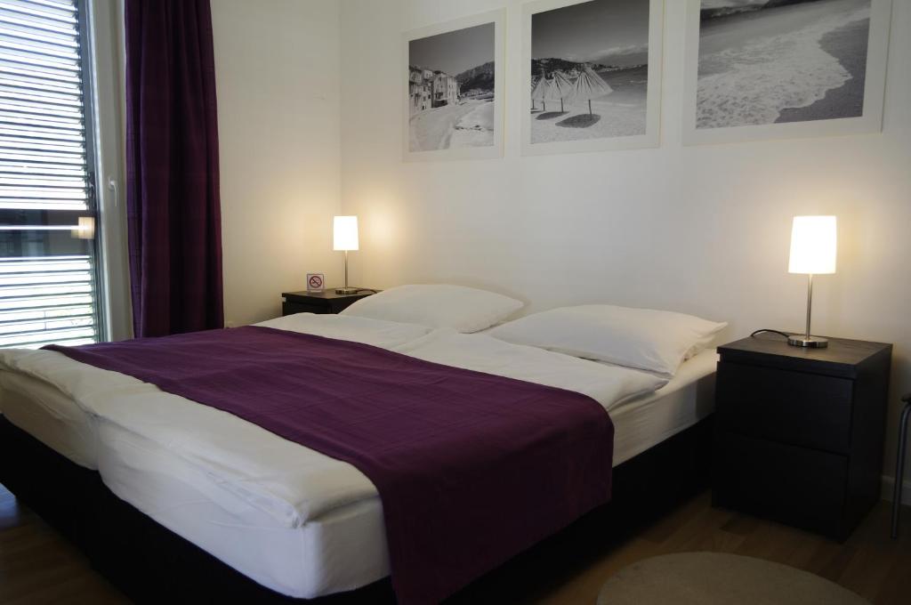 Postel nebo postele na pokoji v ubytování Apartments Santis10