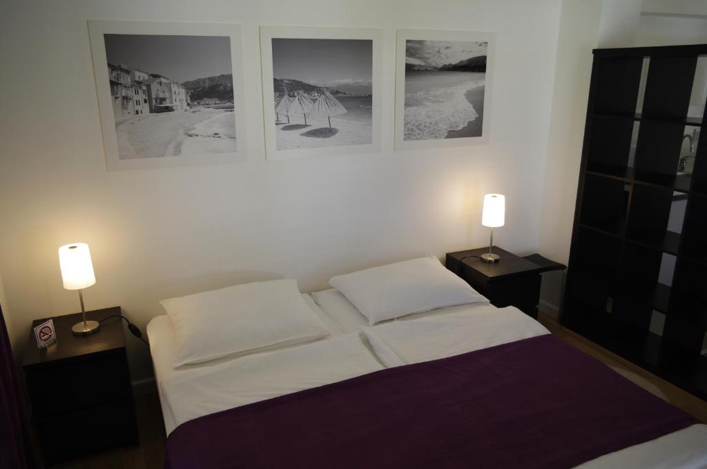 Postel nebo postele na pokoji v ubytování Apartments Santis10