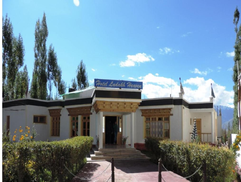 a building with a sign on top of it at Hotel Ladakh Heaven in Leh