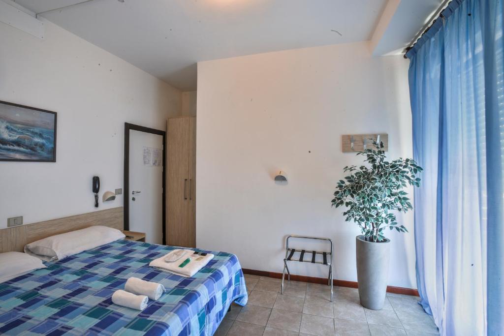 Postel nebo postele na pokoji v ubytování Hotel Continental
