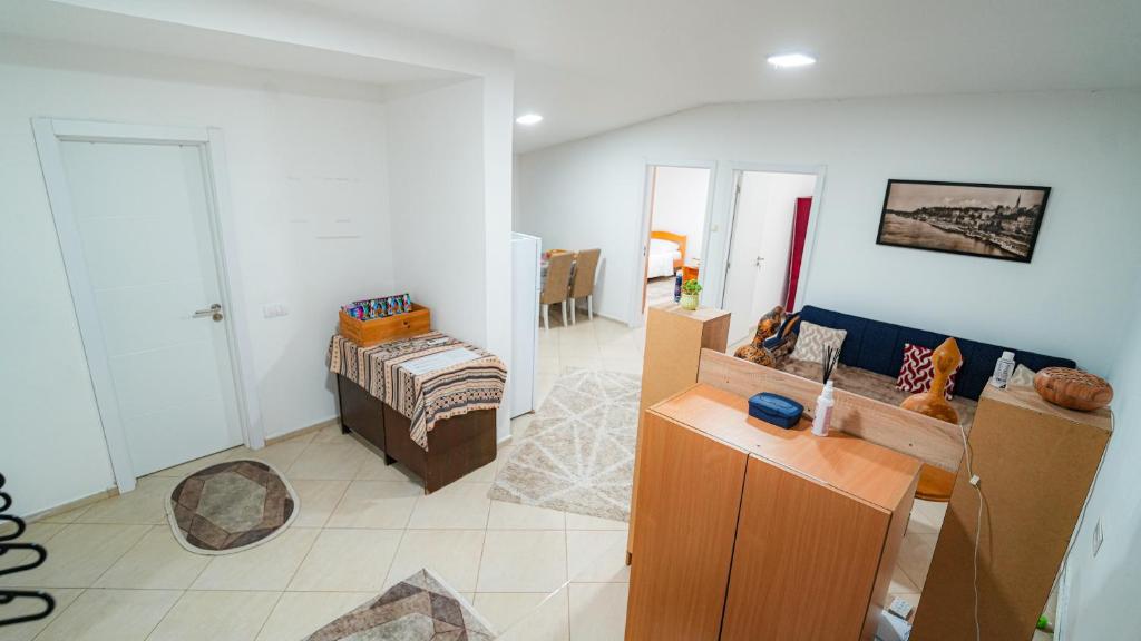 a living room with a couch and a table at Skyline Suites Belgrade in Ledine