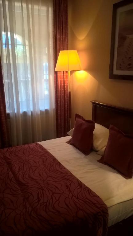 Postel nebo postele na pokoji v ubytování Meduza Hotel & Spa