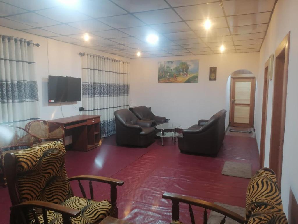 TV a/nebo společenská místnost v ubytování Evergreen Resort Ella