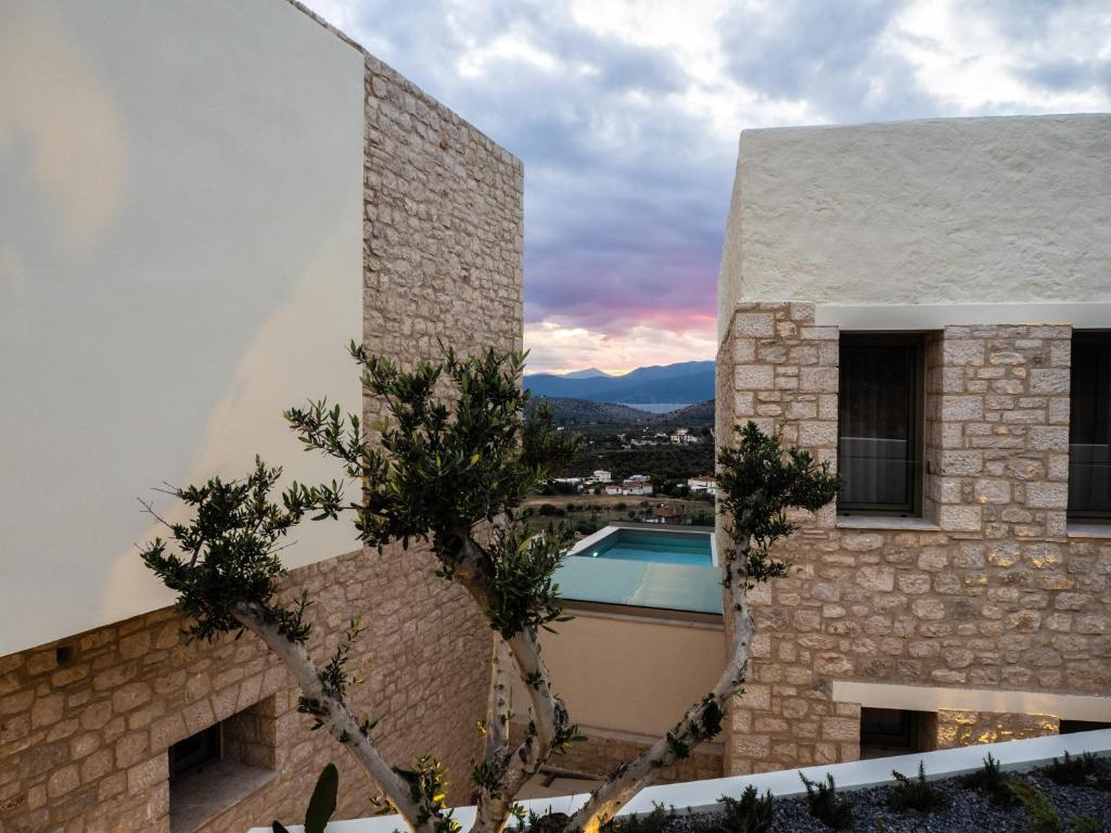 a house with a view of a pool at AnNiko Suites Nafplio in Katsíngrion