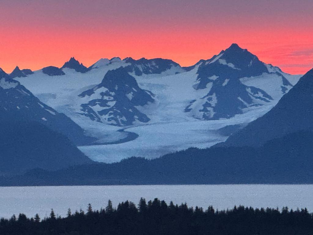 a mountain range with a lake in the foreground at Apartment, walkout basement, Central Homer, Views! in Homer