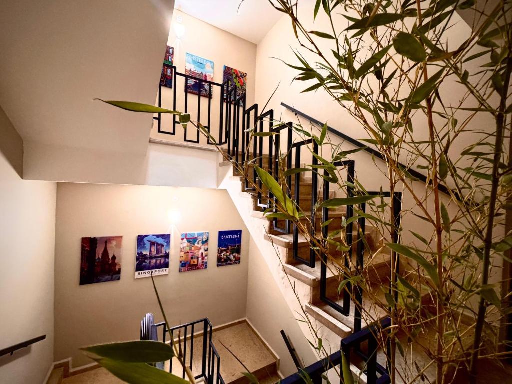 a staircase in a building with pictures on the wall at RR ApartHotel in Ouarzazate