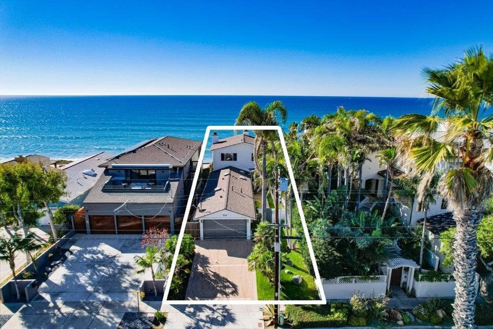 an aerial view of a house with palm trees and the ocean at Surf House in Encinitas