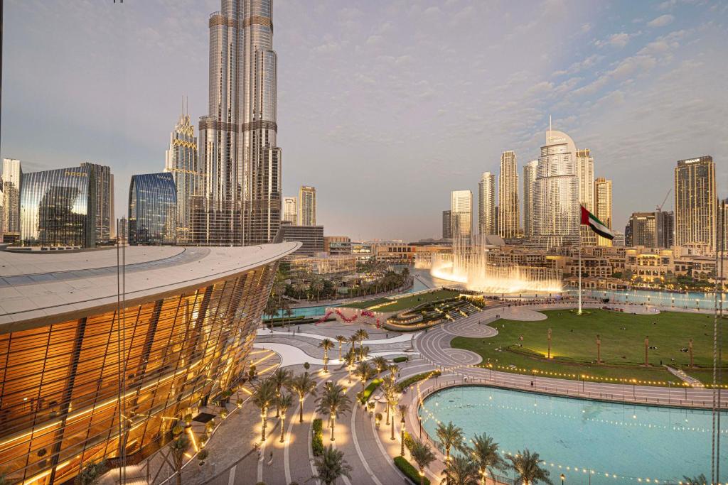 a view of a city skyline with tall buildings at The Grande Signature Experience Modern 2BR with Incredible Views of Burj Khalifa & Dubai Fountain, Steps Away from Dubai Mall in Dubai
