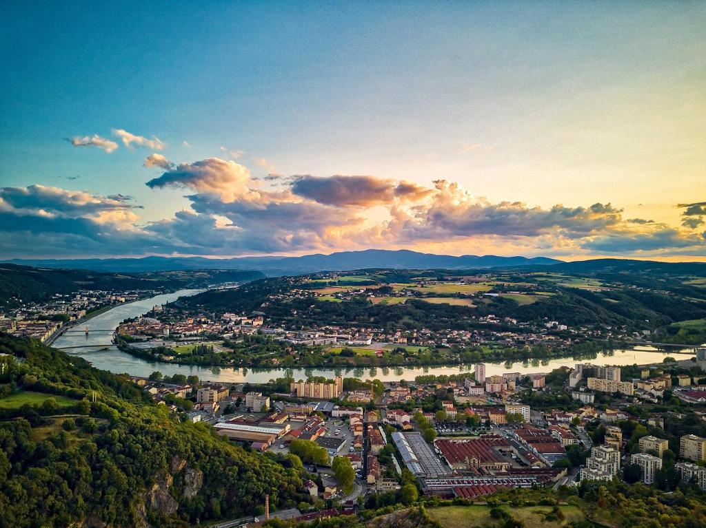 an aerial view of a city and a river at TheNest in Vienne