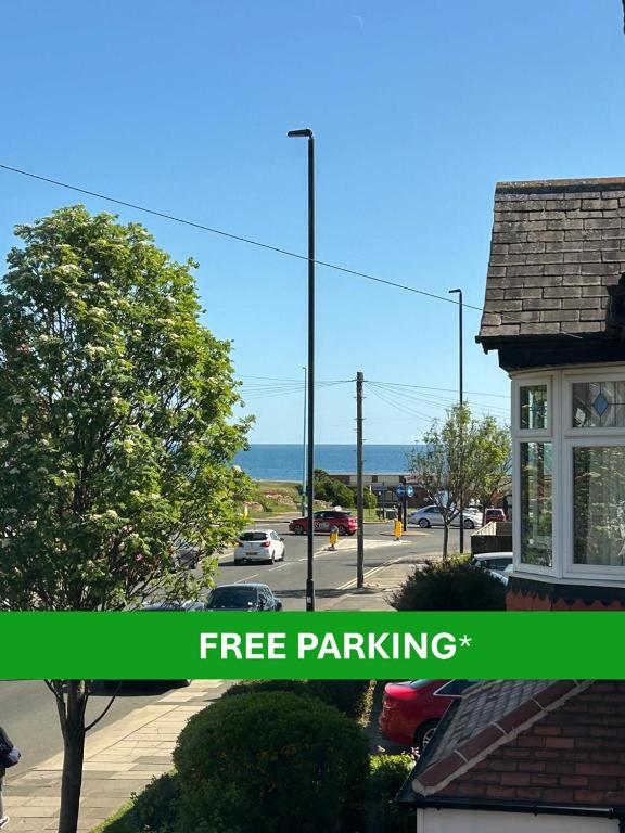 a picture of a parking lot with the words free parking at Bella Beach House in Whitley Bay