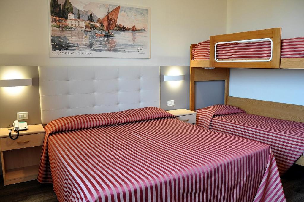Postel nebo postele na pokoji v ubytování Hotel Panoramica