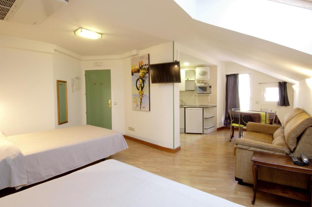 Posteľ alebo postele v izbe v ubytovaní Hotel Apartamentos Aralso