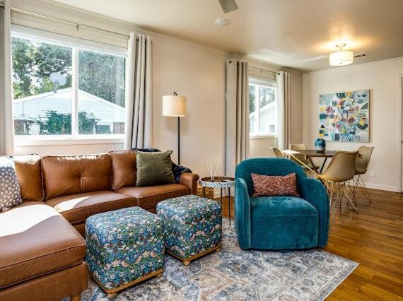 a living room with a couch and a chair at Franklin in the Middle in Jonesboro