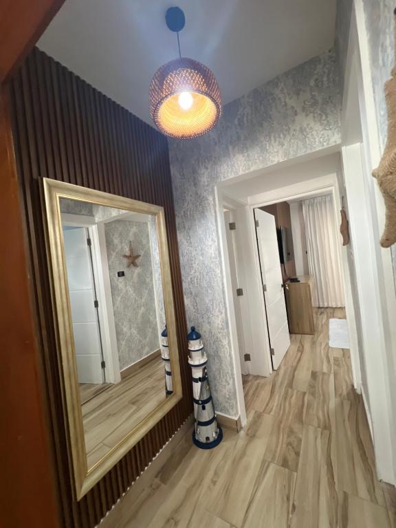 a hallway with a large mirror and a hallway with a hallway at Bayahibe in Bayahibe