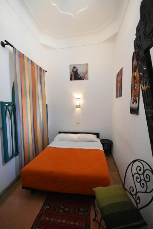 Postel nebo postele na pokoji v ubytování Hotel Dar El Qdima