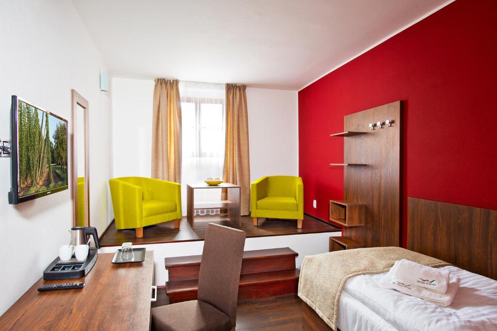 TV a/nebo společenská místnost v ubytování Hotel U Hada Žatec