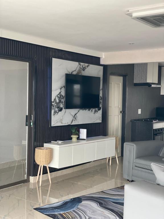 Μια τηλεόραση ή/και κέντρο ψυχαγωγίας στο Nono's Boutique Guesthouse