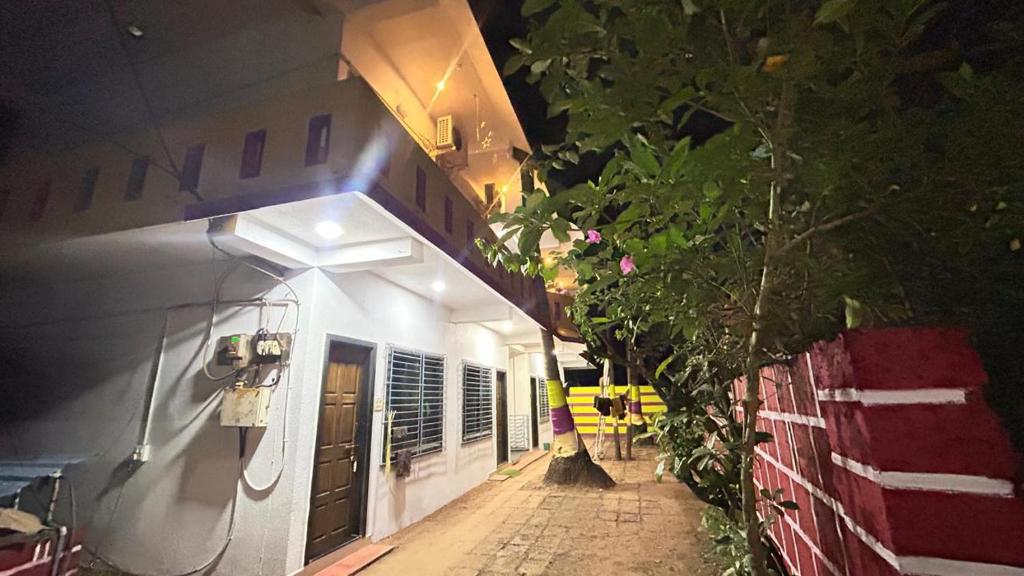 a hallway of a building at night at Ramchandra home stay in Malvan