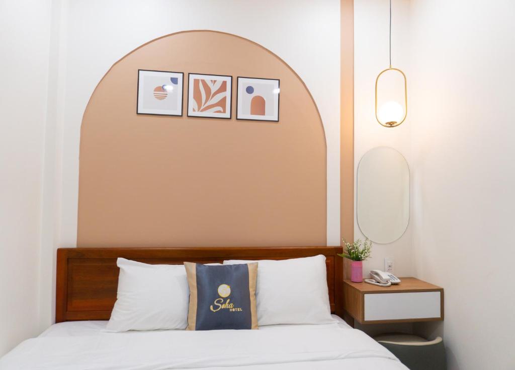 Postel nebo postele na pokoji v ubytování Soha Hotel Cần Thơ