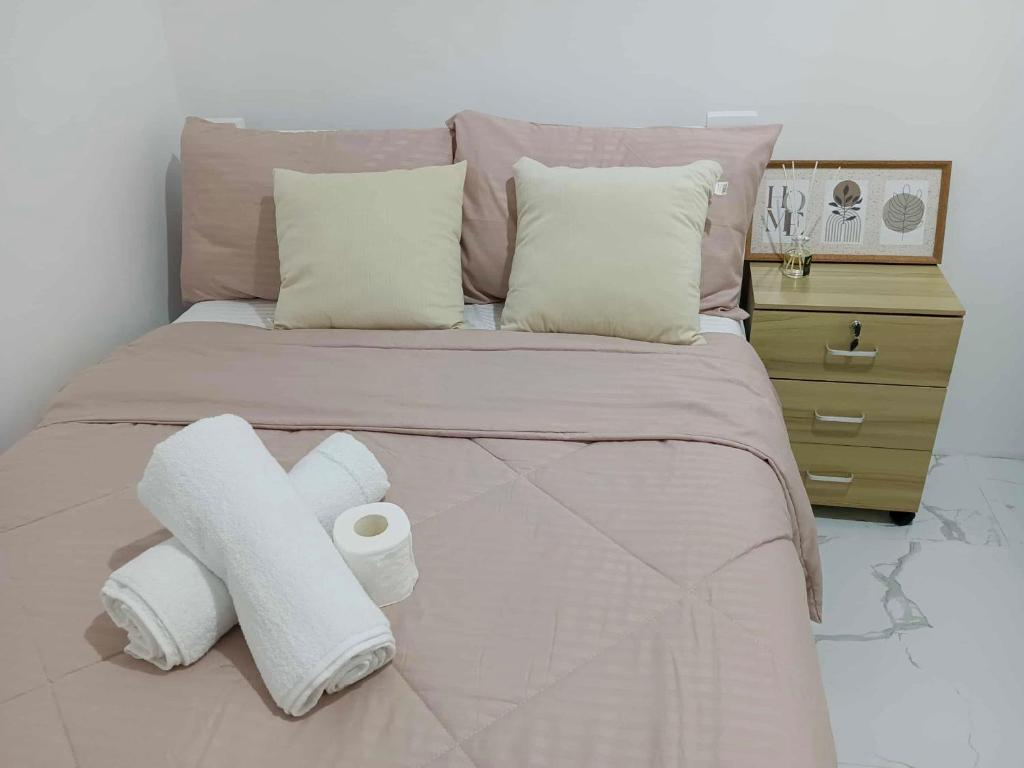 Ένα ή περισσότερα κρεβάτια σε δωμάτιο στο JMary's Stayhouse