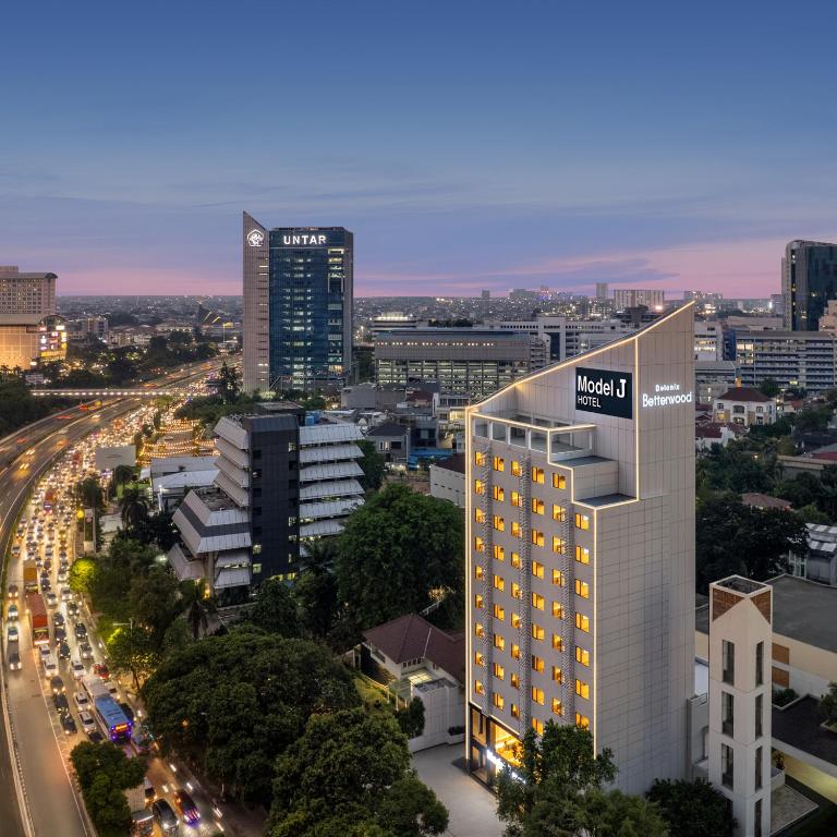 a view of a city with a building at Model J Hotel Jakarta Central Park 曼居酒店 雅加达中央公园店 in Jakarta