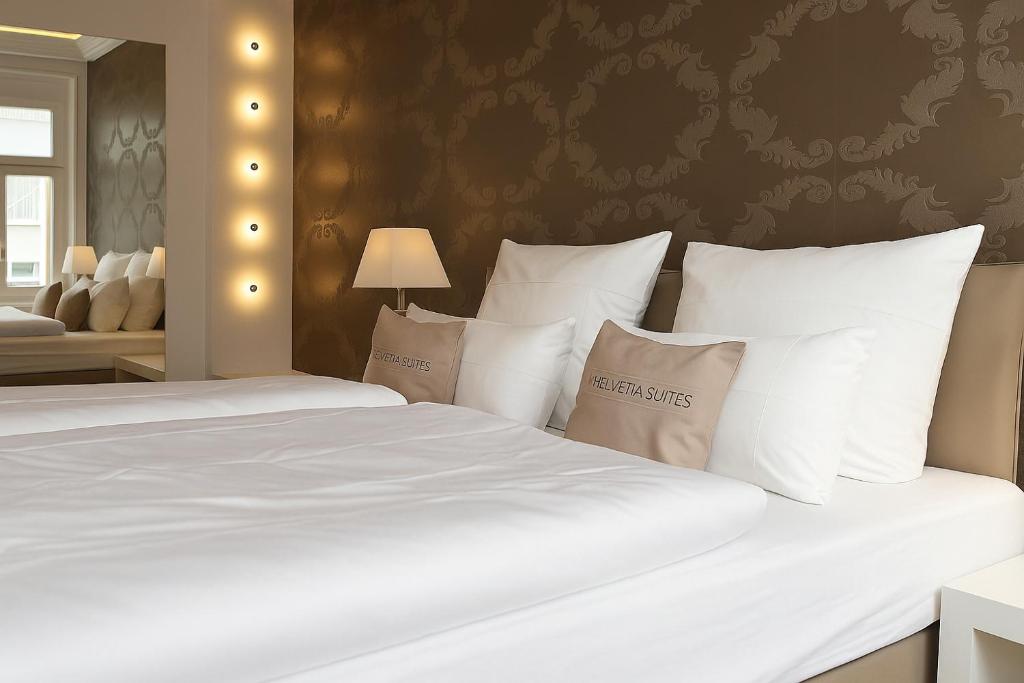 Postel nebo postele na pokoji v ubytování Haven Hotels - Helvetia Suites Düsseldorf City