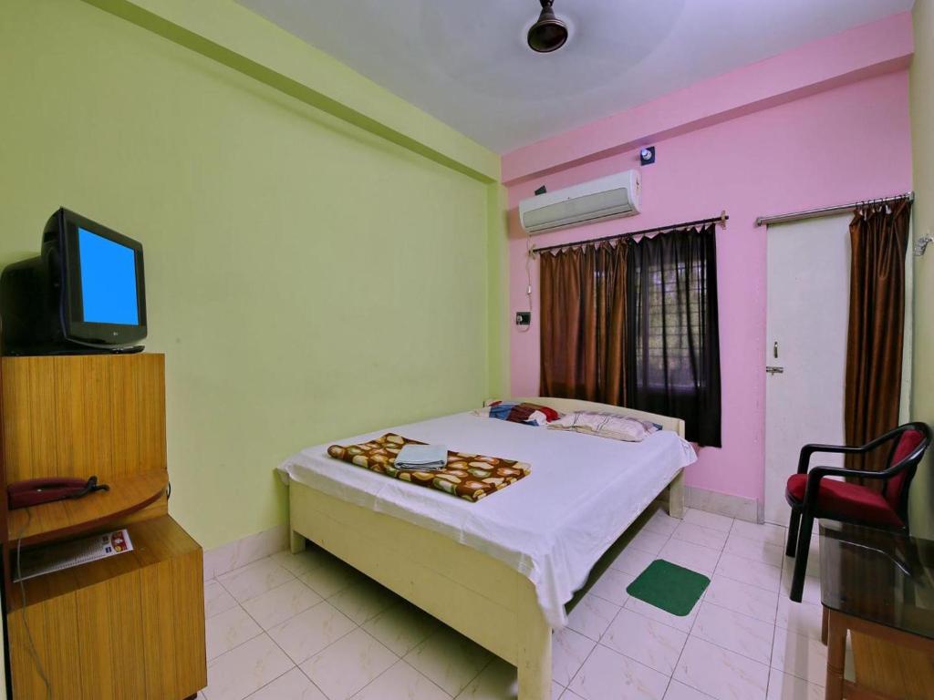 TV a/nebo společenská místnost v ubytování Hotel Cosy Inn