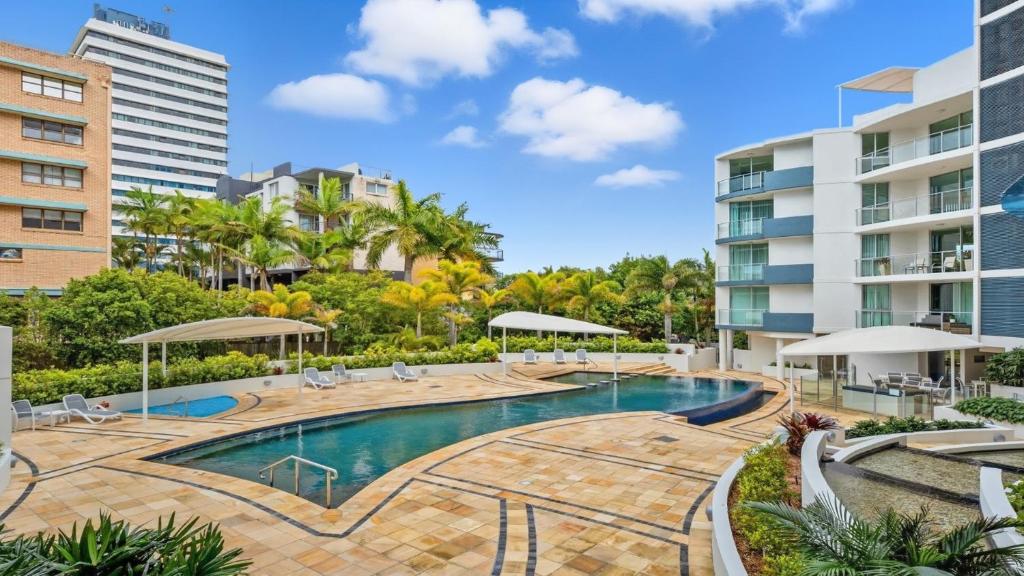 an image of a swimming pool at a resort at Seaside Sovereign Retreat in Caloundra