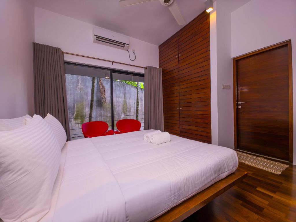 Giường trong phòng chung tại The Tranquil