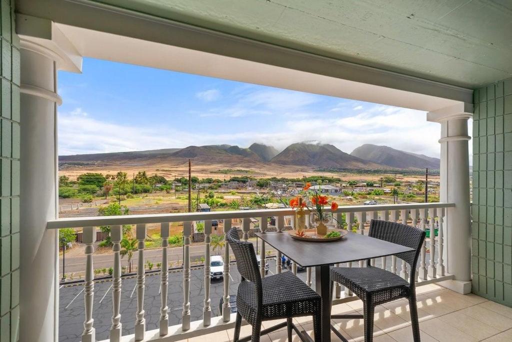 a table and chairs on a balcony with a view at Lahaina Shores 418 · LS 418 Studio Near Beach, Pool & Relaxing H in Lahaina