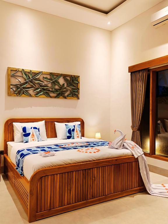 a bedroom with a bed in a room at Bukti Garden Villas in Bukti