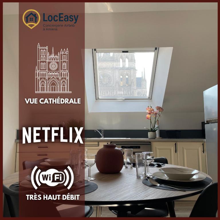 a table in a kitchen with a sign that says netflix at Vue Cathedrale, Elegance & Lumière à Amiens in Amiens