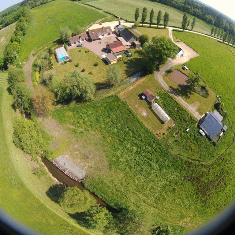 an aerial view of a small house on a field at Gîte la Forterie in Linières-Bouton