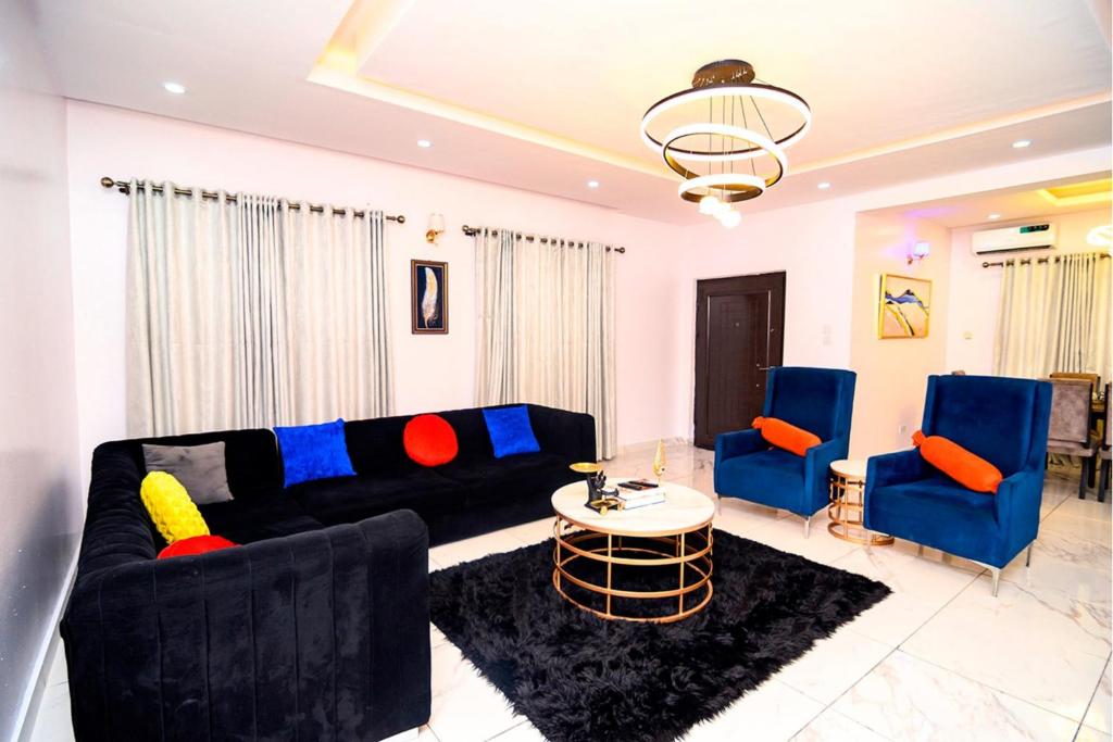 Posezení v ubytování Plush Homes