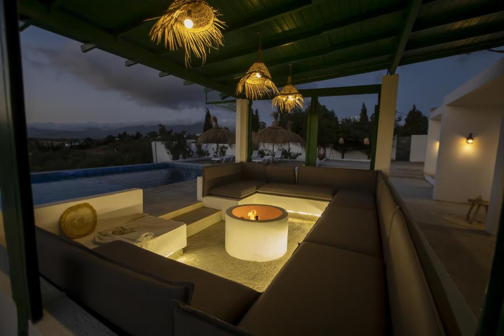 a living room with a candle on a patio at Dar Charkaoui in Tetouan