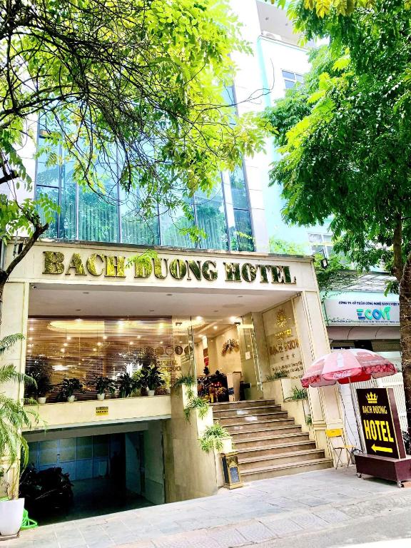 a building with a bag blowing museum on a street at Bạch Dương Hotel Hà Nội in Hanoi