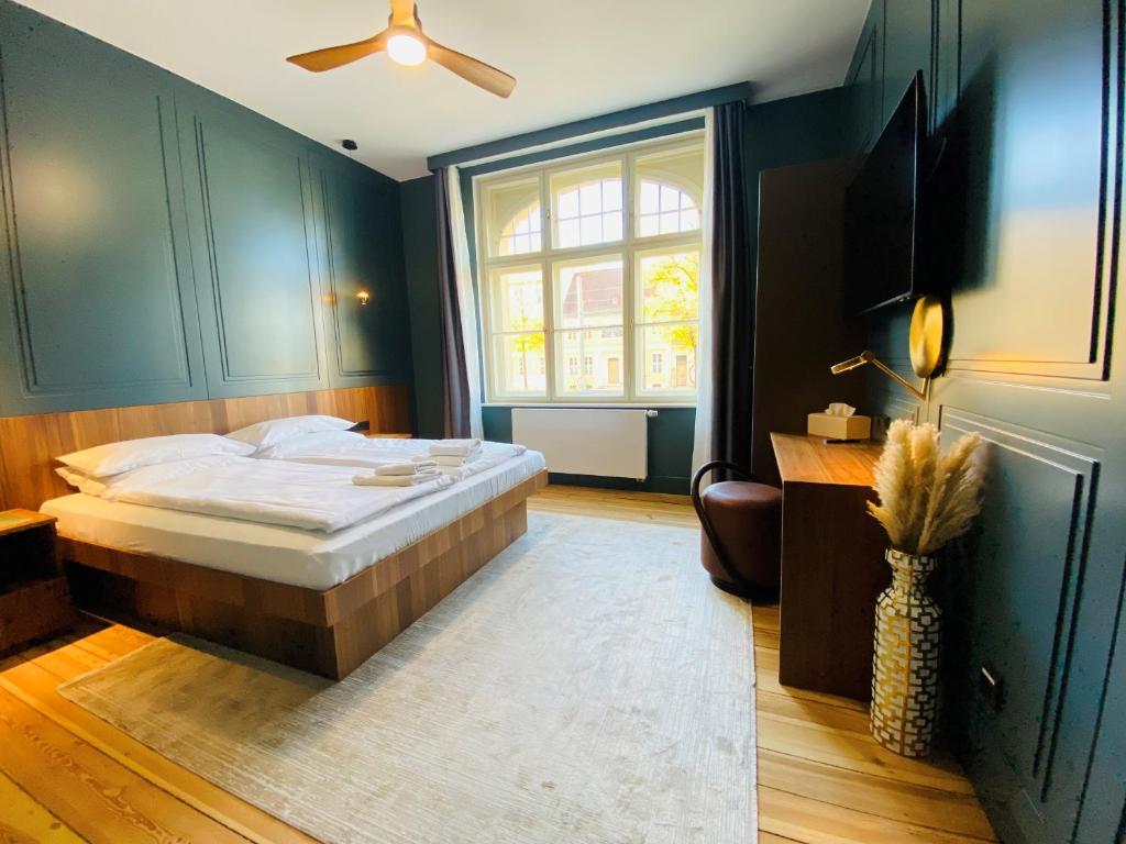 Postel nebo postele na pokoji v ubytování Amaroo - Apartments "Regia"