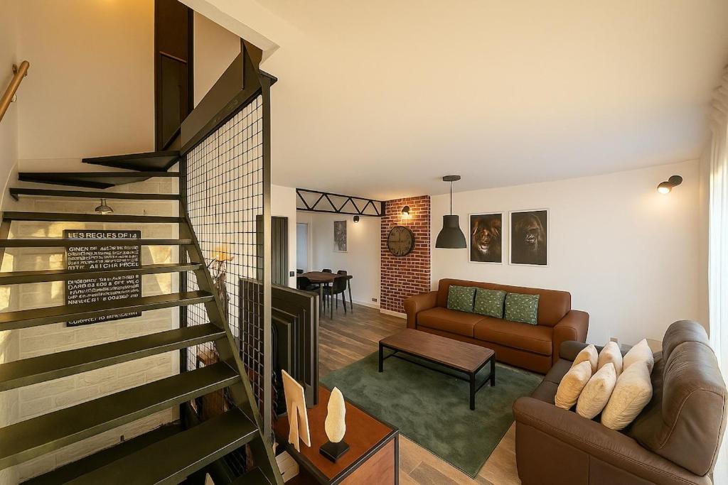 a living room with a staircase leading to a living room at Evasion Verdoyante Vue sur jardin avec balcon et parking in Montigny-le-Bretonneux