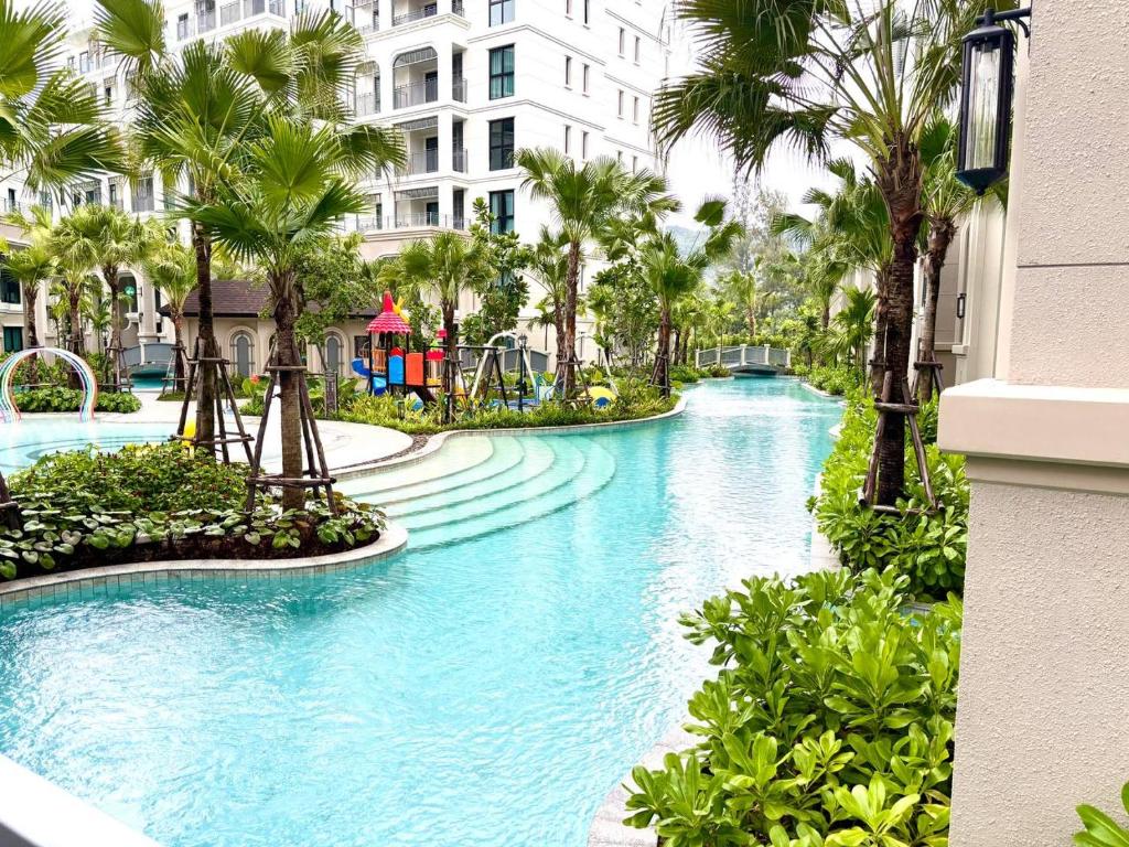 a water park with a playground and palm trees at The Legendary Bang Tao 2-bedrooms apart #402 in Bang Tao Beach