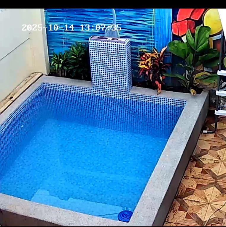 a swimming pool in the middle of a house at La Cabaña de Victor in Olón